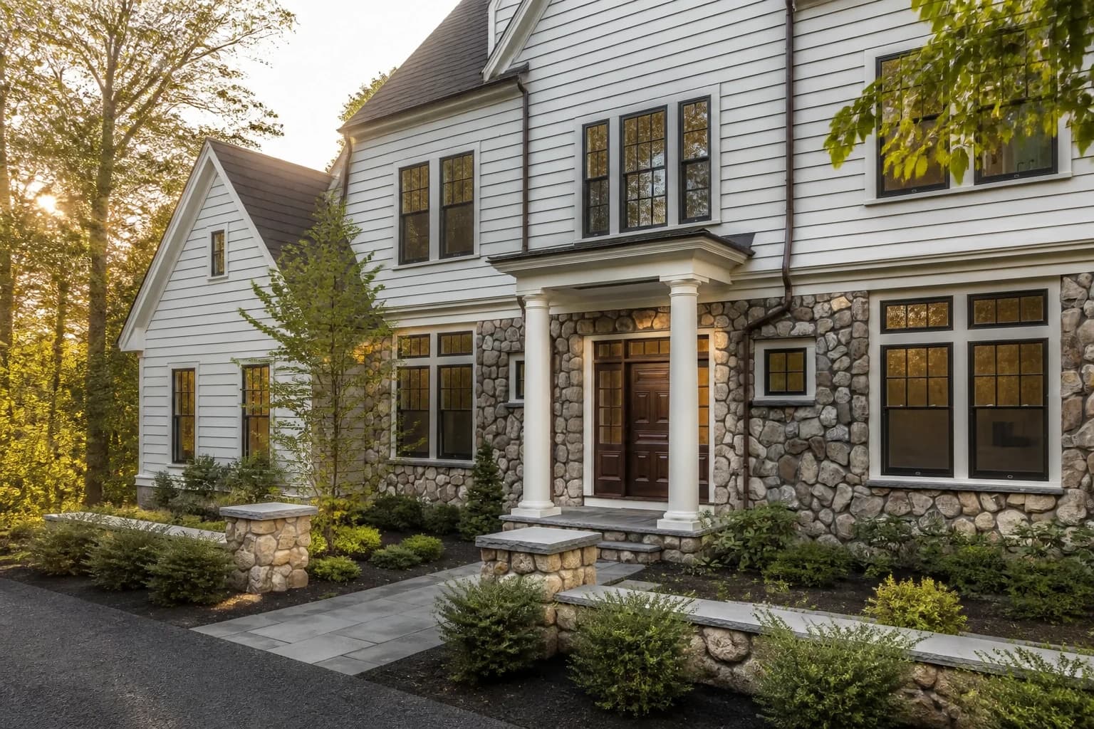 Editorial visualization of a crafted New England home at golden hour