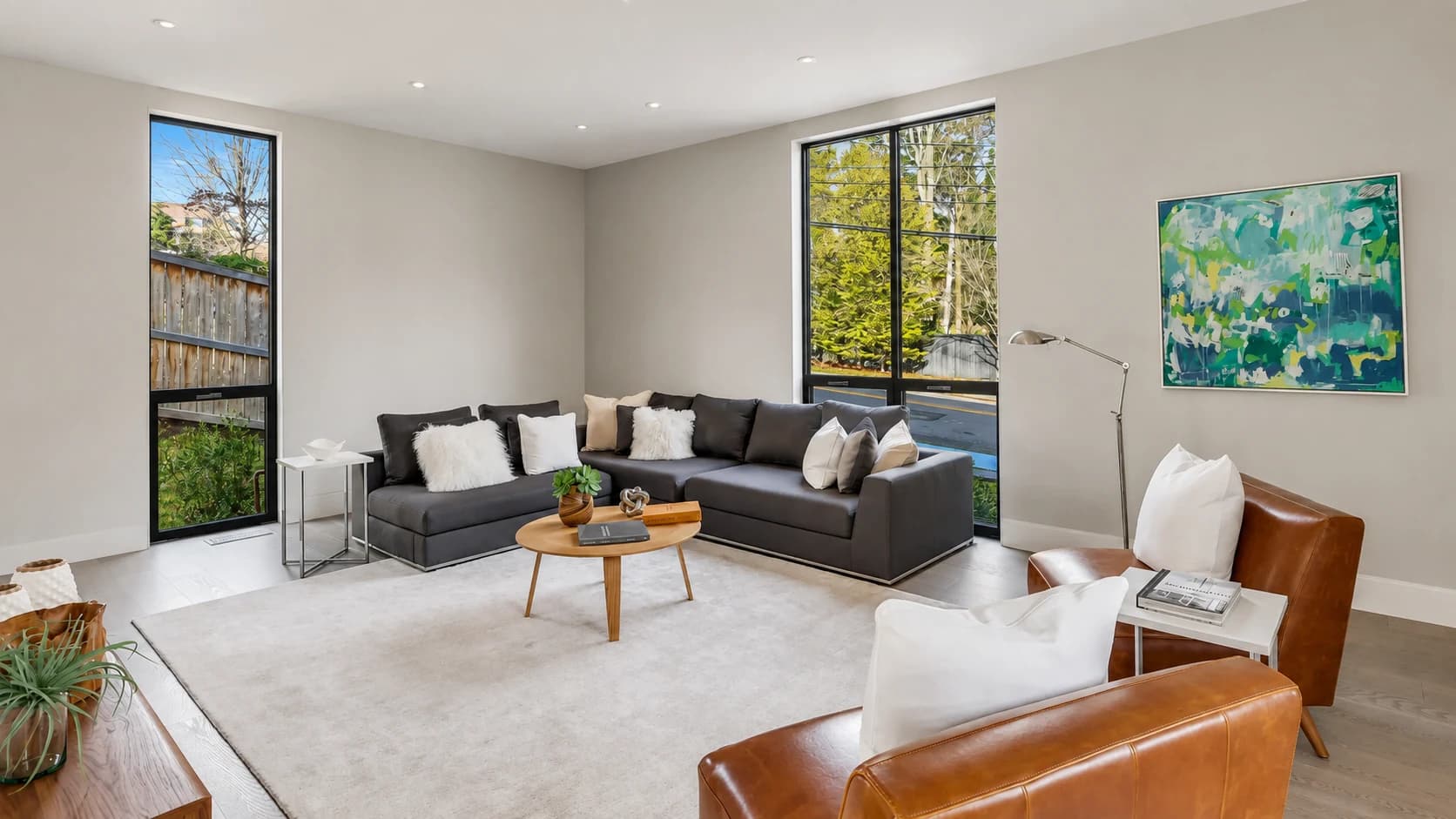 Quiet modern living room with tall windows