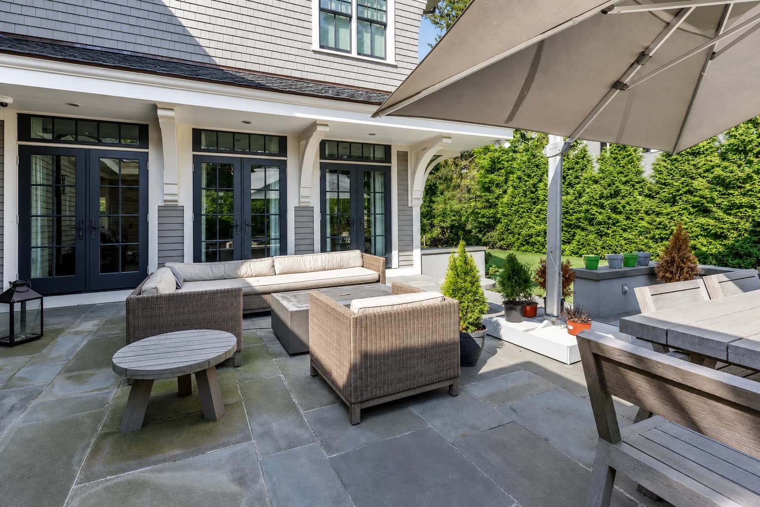 Landscaped stone terrace with outdoor seating